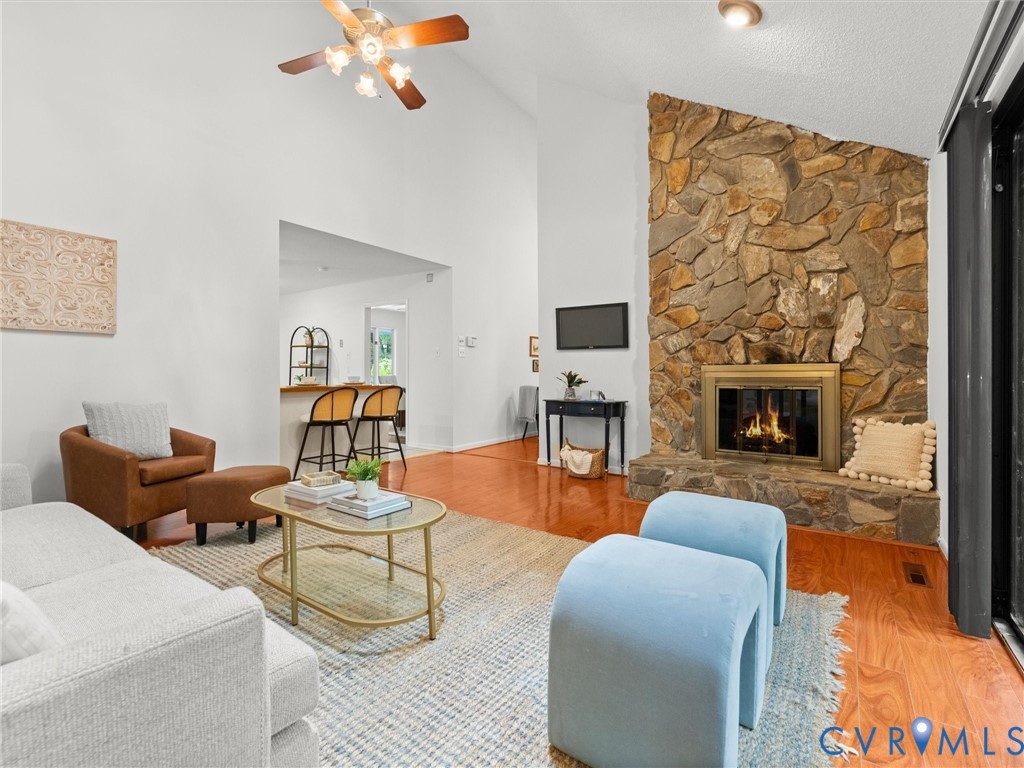 1625 Stone River Road North Chesterfield, VA 23235 - Photo 21 of 49 Living area featuring a stone fireplace with a gol