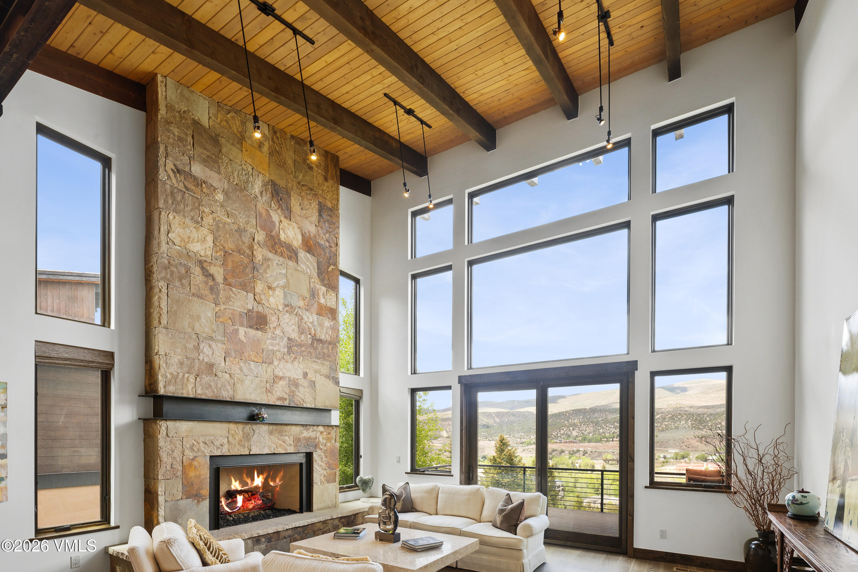 91 Edwards Pointe Edwards, CO 81632 - Photo 4 of 39 a living room with furniture a fireplace and a large window