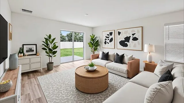 a living room with furniture and a large window