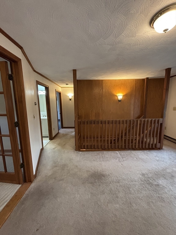 97-99 Roffee Street, Unit 1 Barrington, RI 02806 - Photo 12 of 28 a view of a hallway with wooden floor