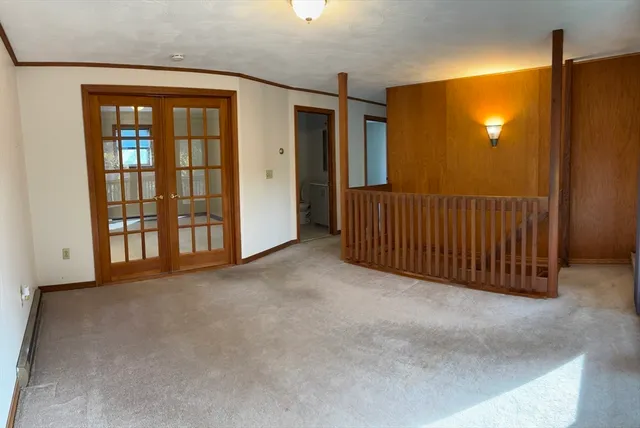 a view of an empty room with windows