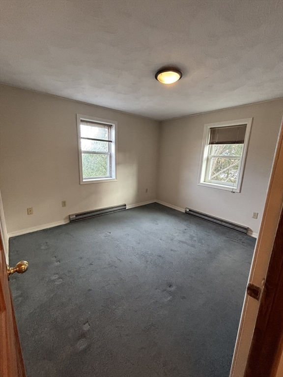 97-99 Roffee Street, Unit 1 Barrington, RI 02806 - Photo 18 of 28 an empty room with a window