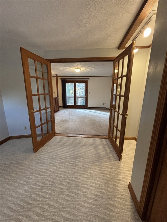 97-99 Roffee Street, Unit 1 Barrington, RI 02806 - Photo 2 of 28 a view of an empty room with window and wooden floor