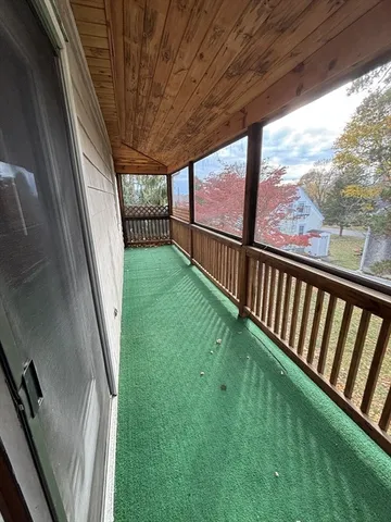 a view of backyard with a large tree