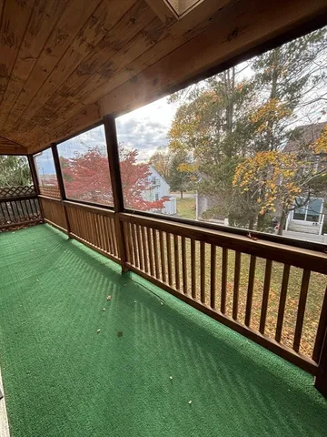 a view of porch with a yard