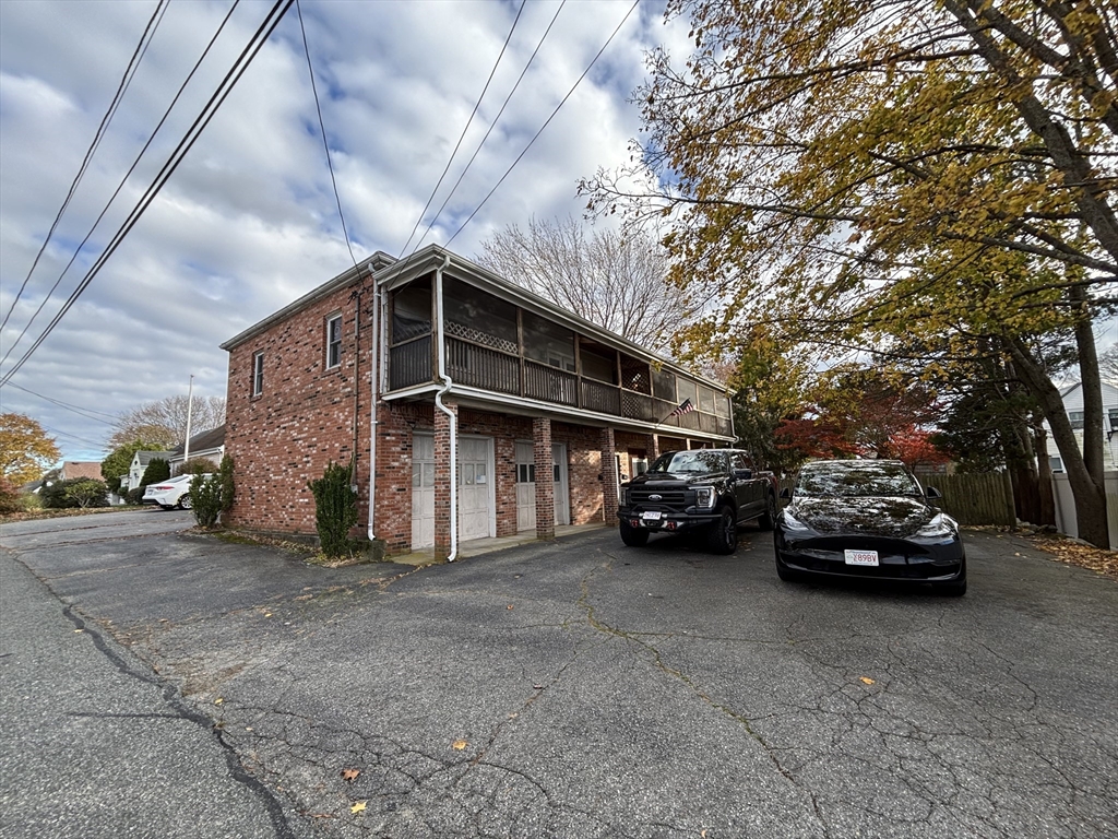 97-99 Roffee Street, Unit 1 Barrington, RI 02806 - Photo 24 of 28 a view of a car parked in garage