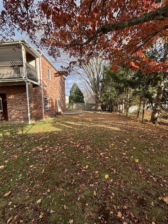 97-99 Roffee Street, Unit 1 Barrington, RI 02806 - Photo 26 of 28 a view of a house with a yard