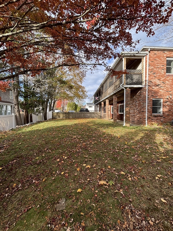 97-99 Roffee Street, Unit 1 Barrington, RI 02806 - Photo 28 of 28 a view of a house with a yard