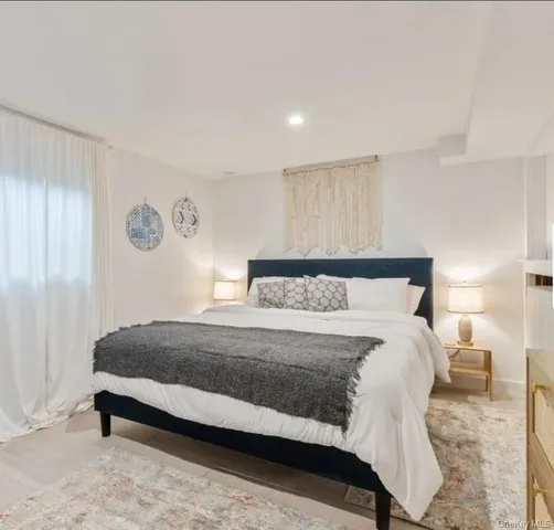 a bedroom with a bed and lamp