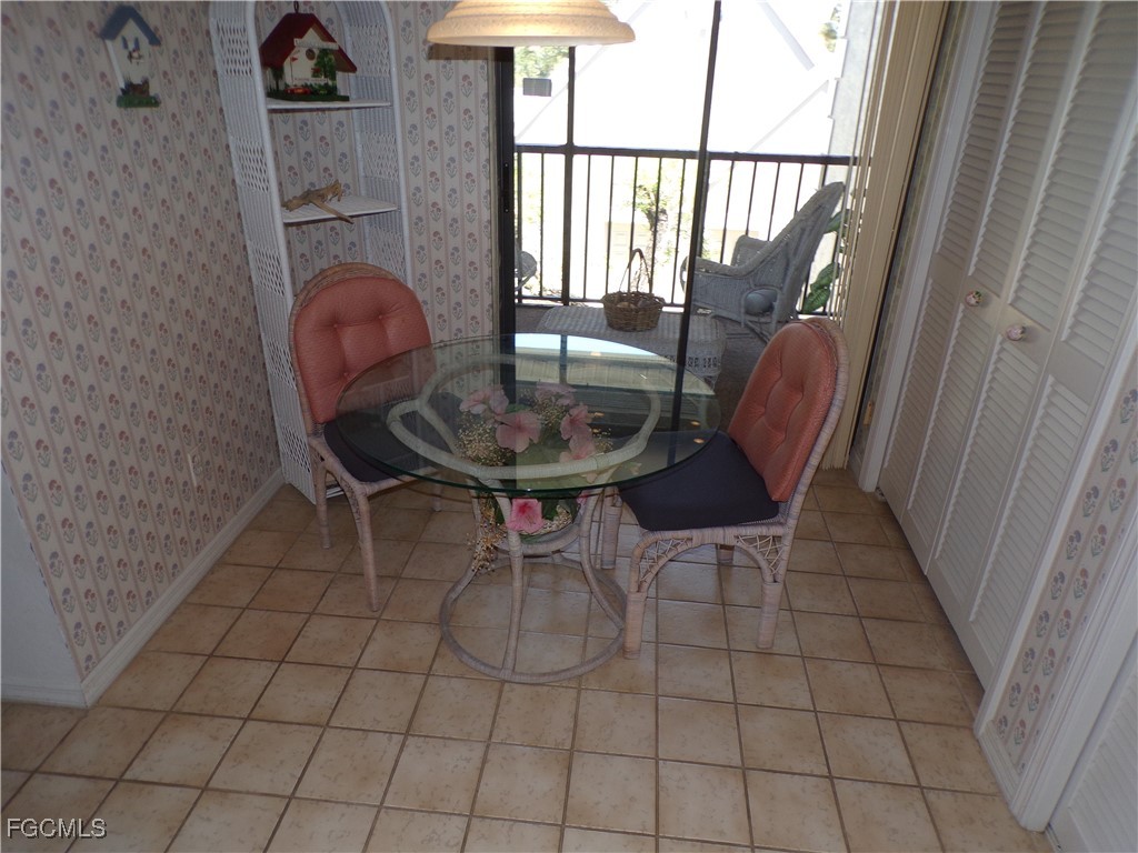 16200 Kelly Cove Drive, Unit 215 Fort Myers, FL 33908 - Photo 12 of 46 a view of a dining room with furniture window and outside view