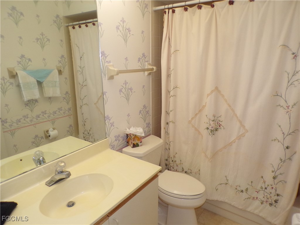 16200 Kelly Cove Drive, Unit 215 Fort Myers, FL 33908 - Photo 14 of 46 a bathroom with a sink toilet and shower