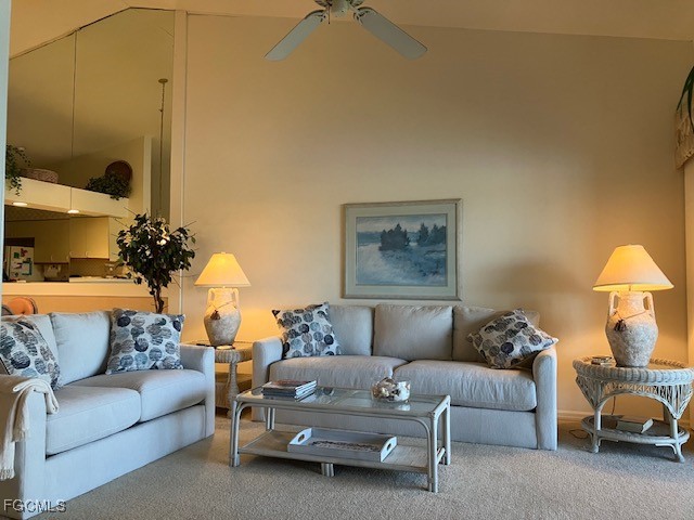 16200 Kelly Cove Drive, Unit 215 Fort Myers, FL 33908 - Photo 17 of 46 a living room with a couch and a potted plant