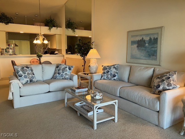 16200 Kelly Cove Drive, Unit 215 Fort Myers, FL 33908 - Photo 18 of 46 a living room with furniture and a painting