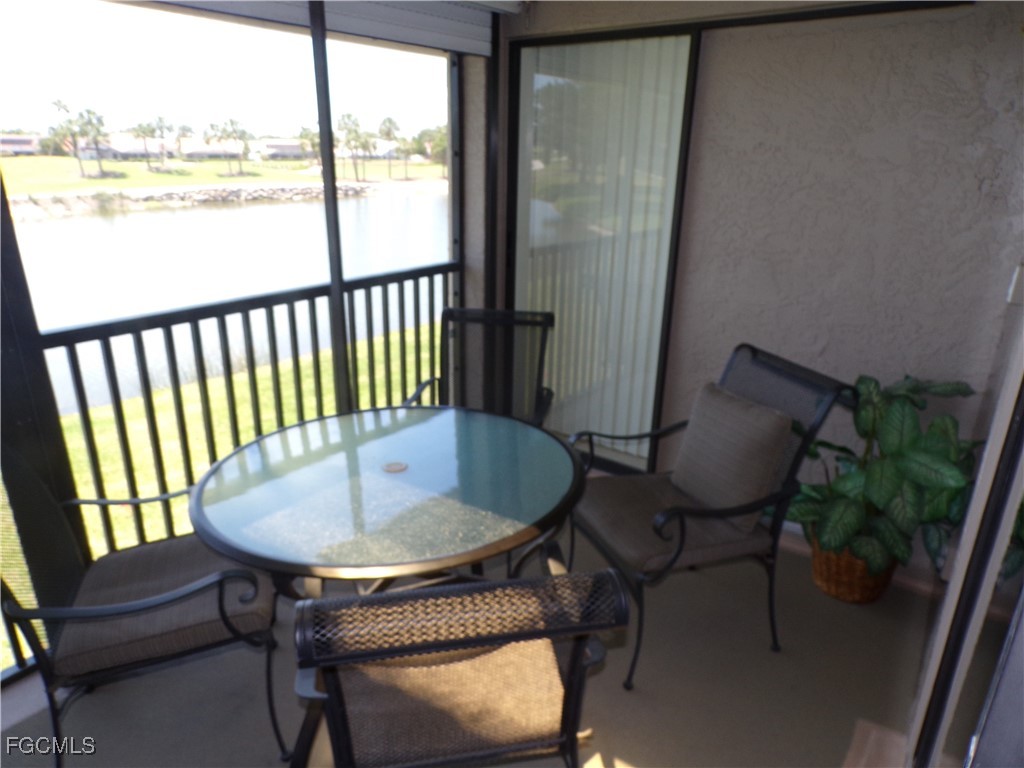 16200 Kelly Cove Drive, Unit 215 Fort Myers, FL 33908 - Photo 22 of 46 a dining room with furniture and window
