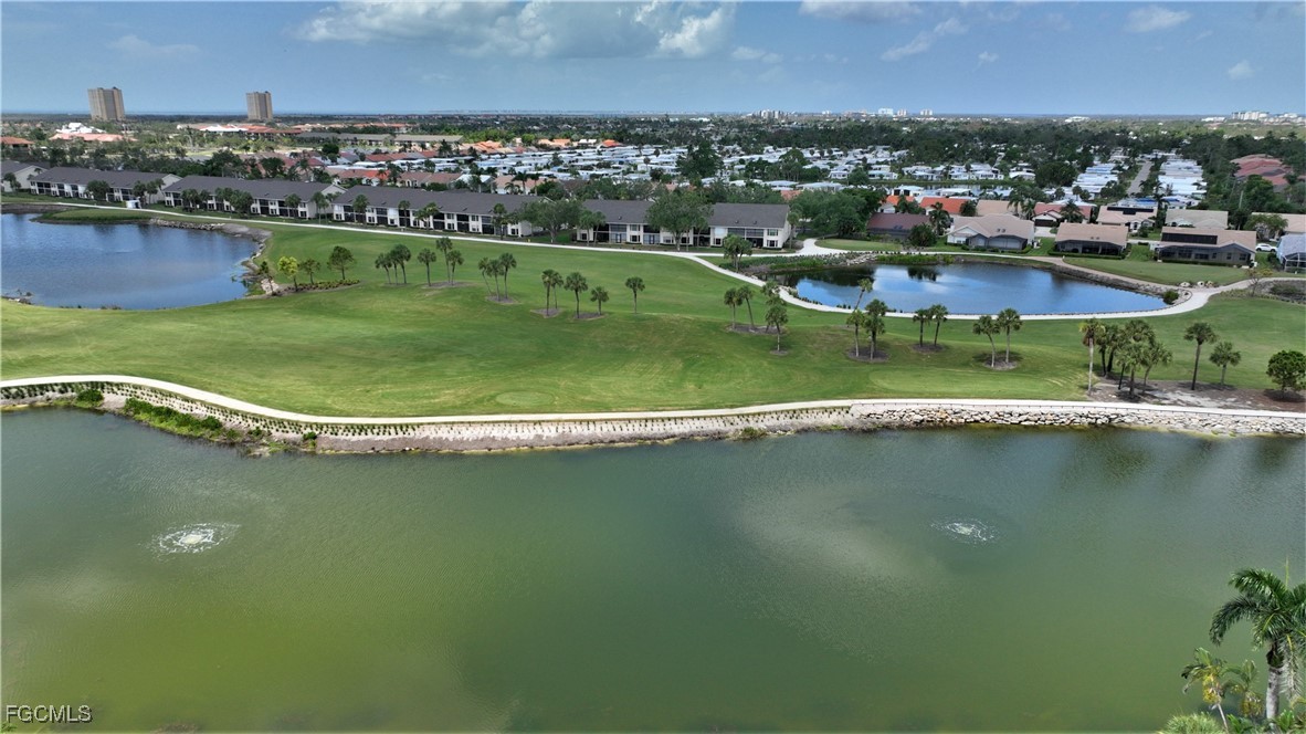 16200 Kelly Cove Drive, Unit 215 Fort Myers, FL 33908 - Photo 31 of 46 an aerial view of residential houses with outdoor space and lake view