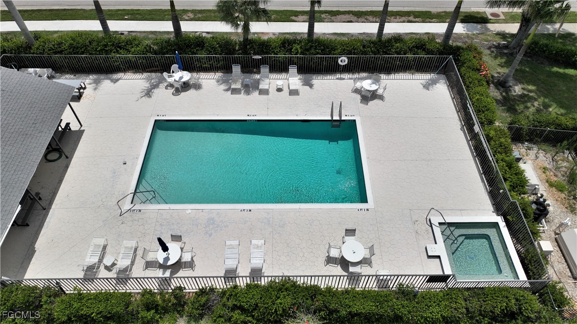 16200 Kelly Cove Drive, Unit 215 Fort Myers, FL 33908 - Photo 33 of 46 a view of swimming pool with outdoor seating