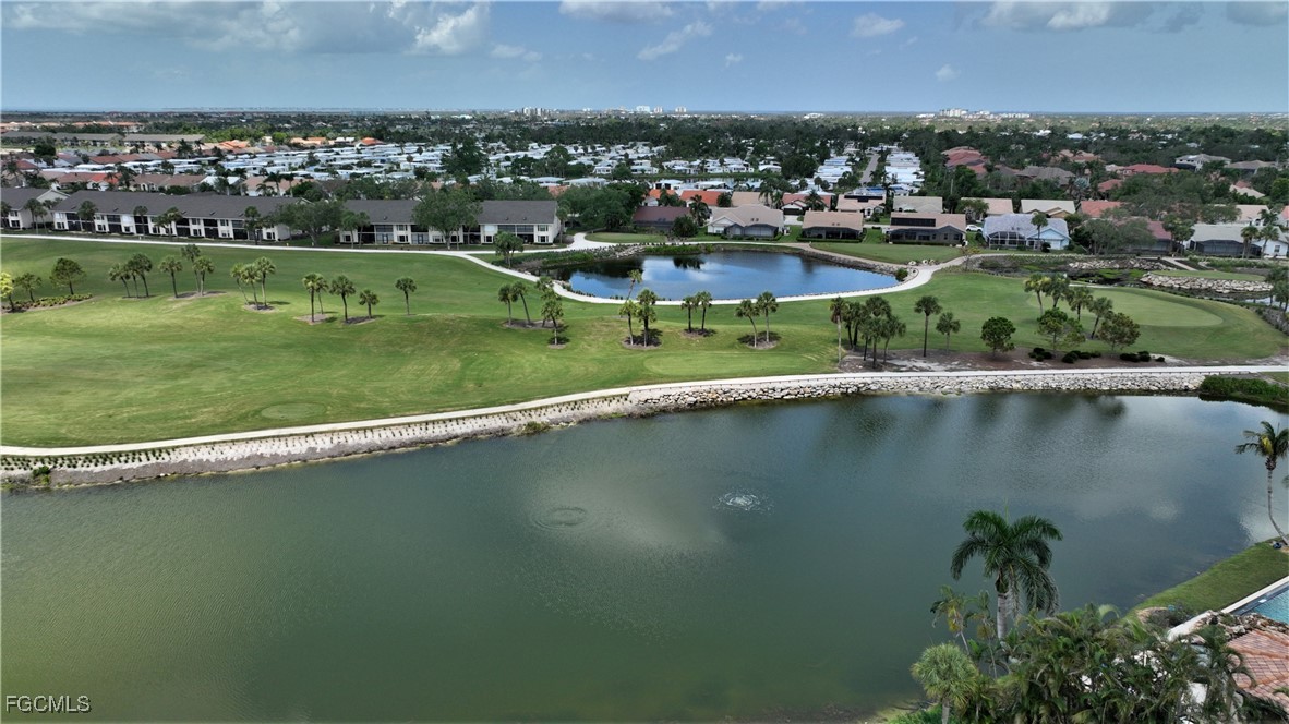 16200 Kelly Cove Drive, Unit 215 Fort Myers, FL 33908 - Photo 39 of 46 an aerial view of a houses with a yard and lake view