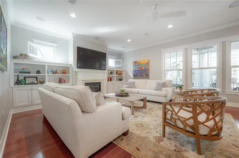 a living room with fireplace furniture and a flat screen tv