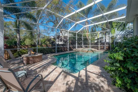 a view of yard with swimming pool outdoor seating and green space