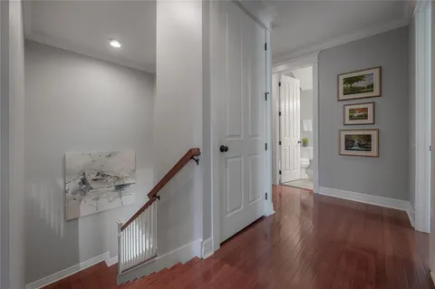 a view of an entryway with wooden floor