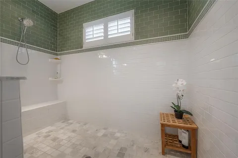 a bathroom with a sink and shower