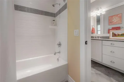 a bathroom with a bathtub and a sink