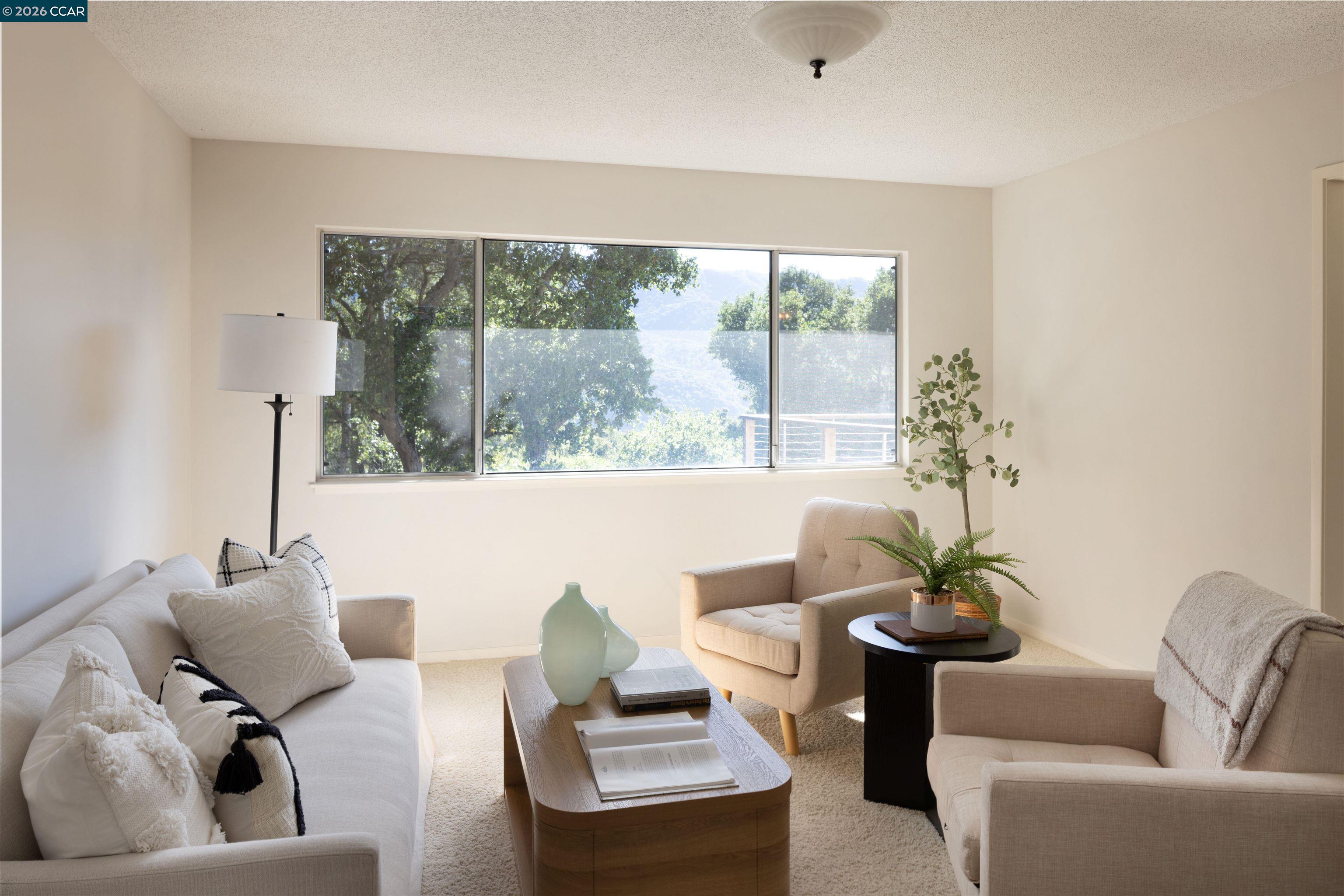 12 Marquard Road Carmel Valley, CA 93924 - Photo 14 of 36 a living room with furniture and a large window