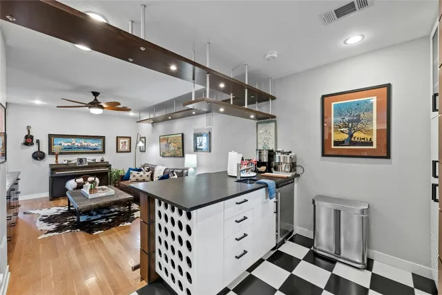 a kitchen that has a lot of cabinets in it