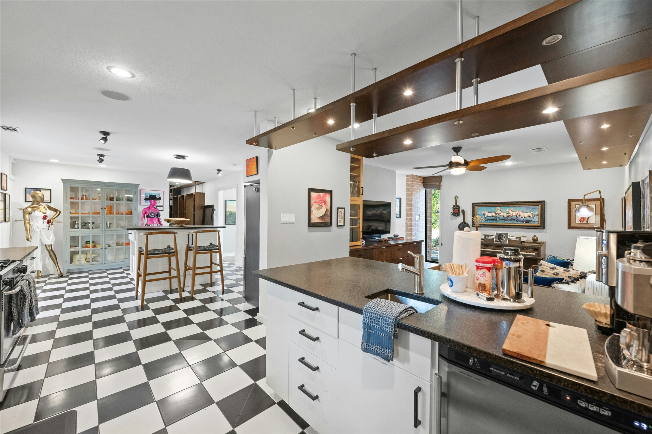 2409 East Side Drive Austin, TX 78704 - Photo 40 of 40 a kitchen with stainless steel appliances kitchen island granite countertop a sink and cabinets