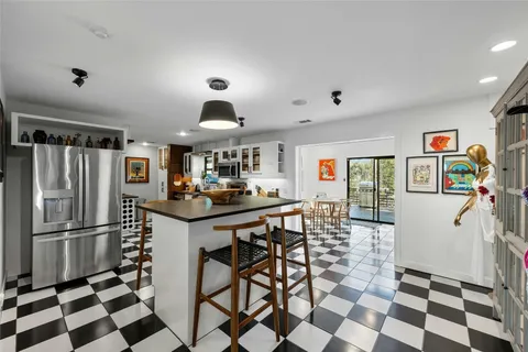 a kitchen with stainless steel appliances granite countertop a sink and cabinets