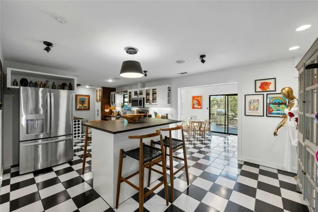 a kitchen with stainless steel appliances granite countertop a sink and cabinets