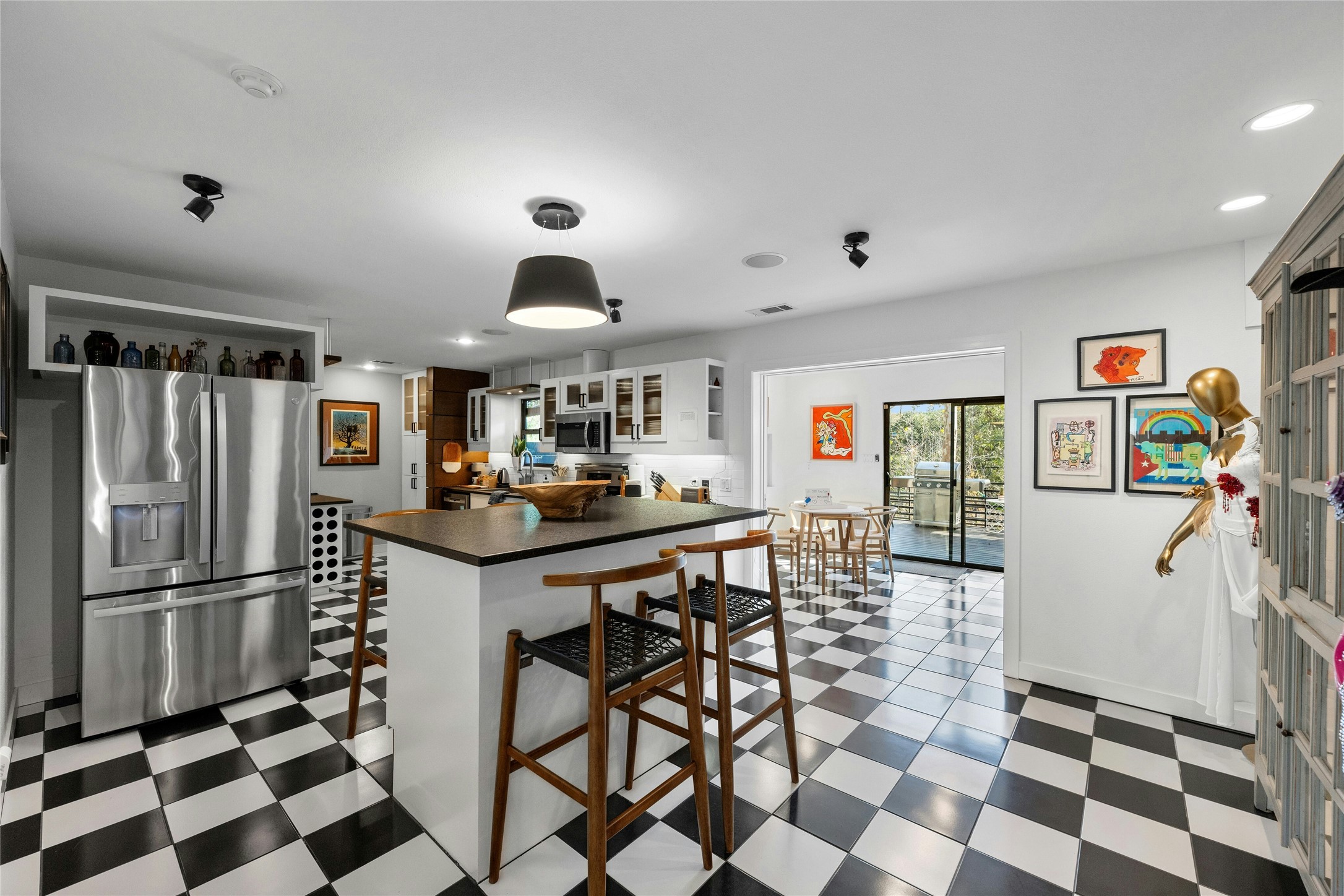 2409 East Side Drive Austin, TX 78704 - Photo 13 of 40 a kitchen with stainless steel appliances granite countertop a refrigerator and a sink