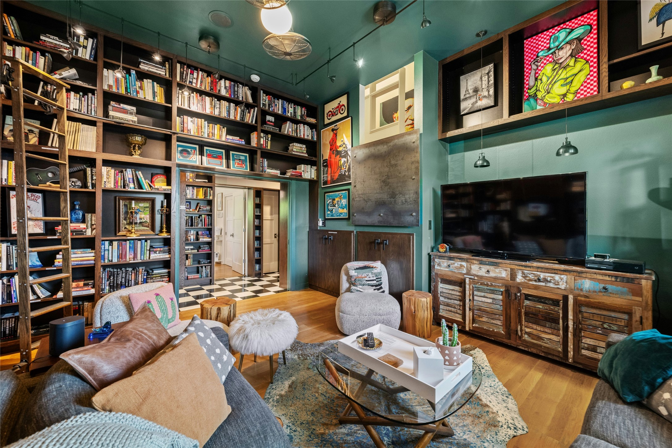 2409 East Side Drive Austin, TX 78704 - Photo 16 of 40 a living room with furniture a flat screen tv and a bookshelf