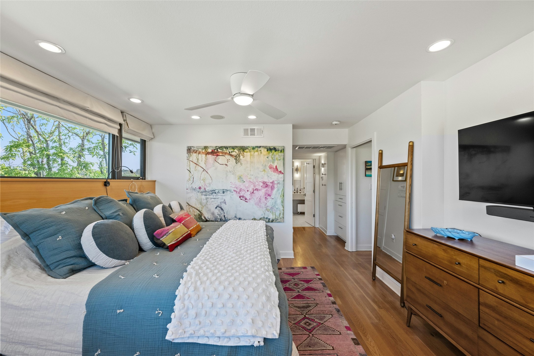 2409 East Side Drive Austin, TX 78704 - Photo 19 of 40 a bedroom with a bed and wooden floor