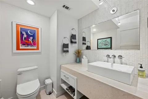 a bathroom with a sink a mirror and a shower