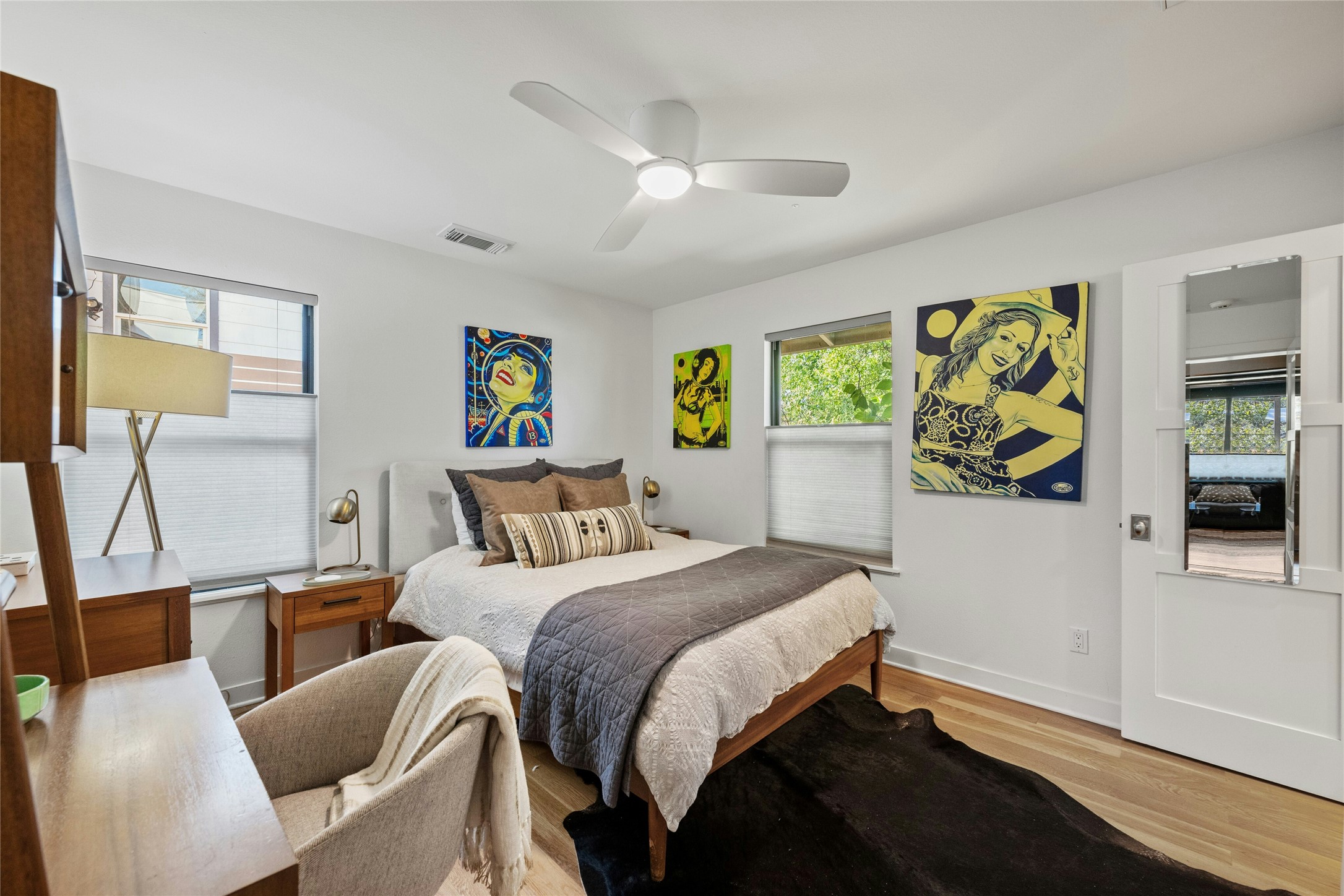 2409 East Side Drive Austin, TX 78704 - Photo 28 of 40 a bedroom with a bed and wooden floor