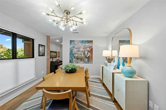 a dining room with furniture and window