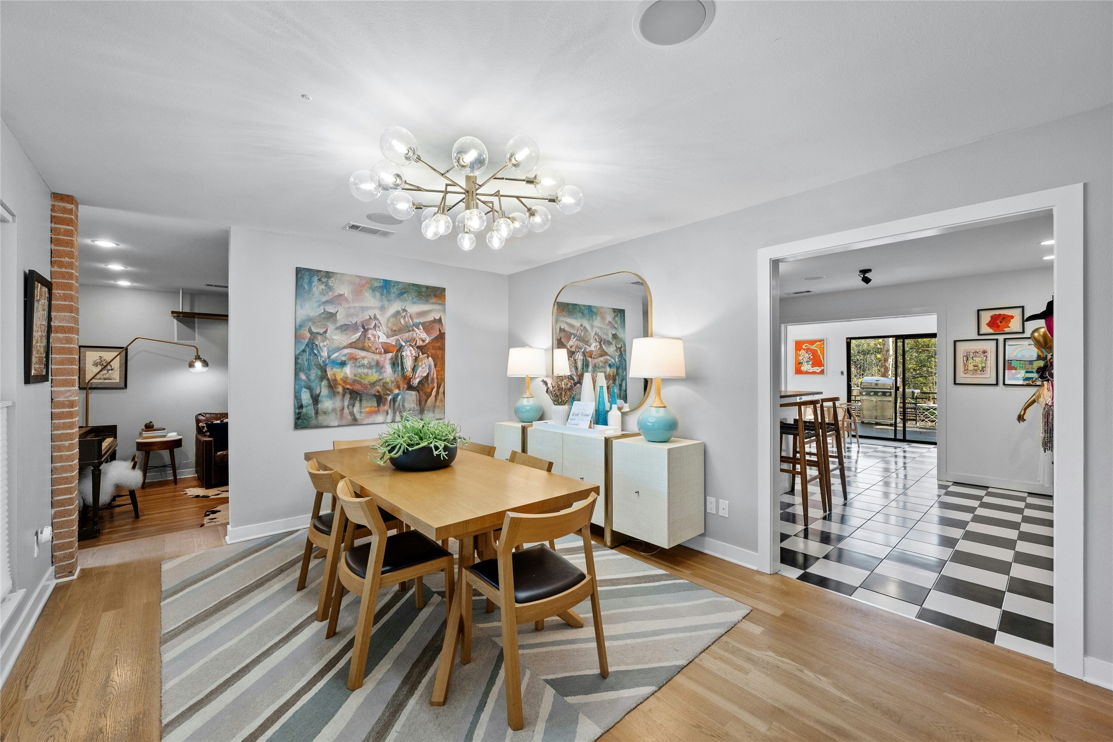 2409 East Side Drive Austin, TX 78704 - Photo 5 of 40 a view of a dining room with furniture window and wooden floor
