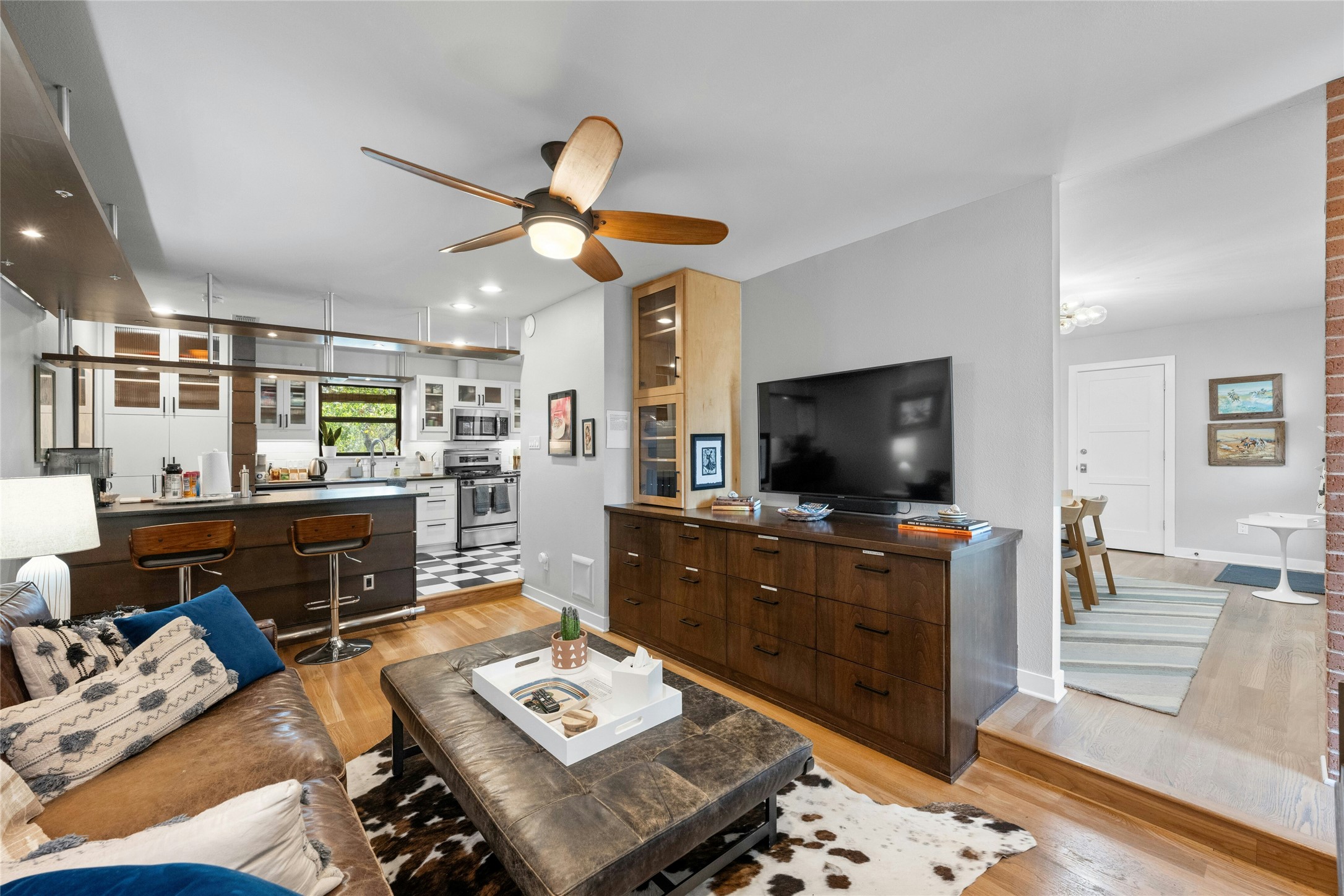 2409 East Side Drive Austin, TX 78704 - Photo 8 of 40 a living room with furniture and a flat screen tv