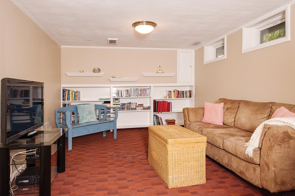 272 Spiers Road Newton, MA 02459 - Photo 8 of 9 a living room with furniture and a flat screen tv