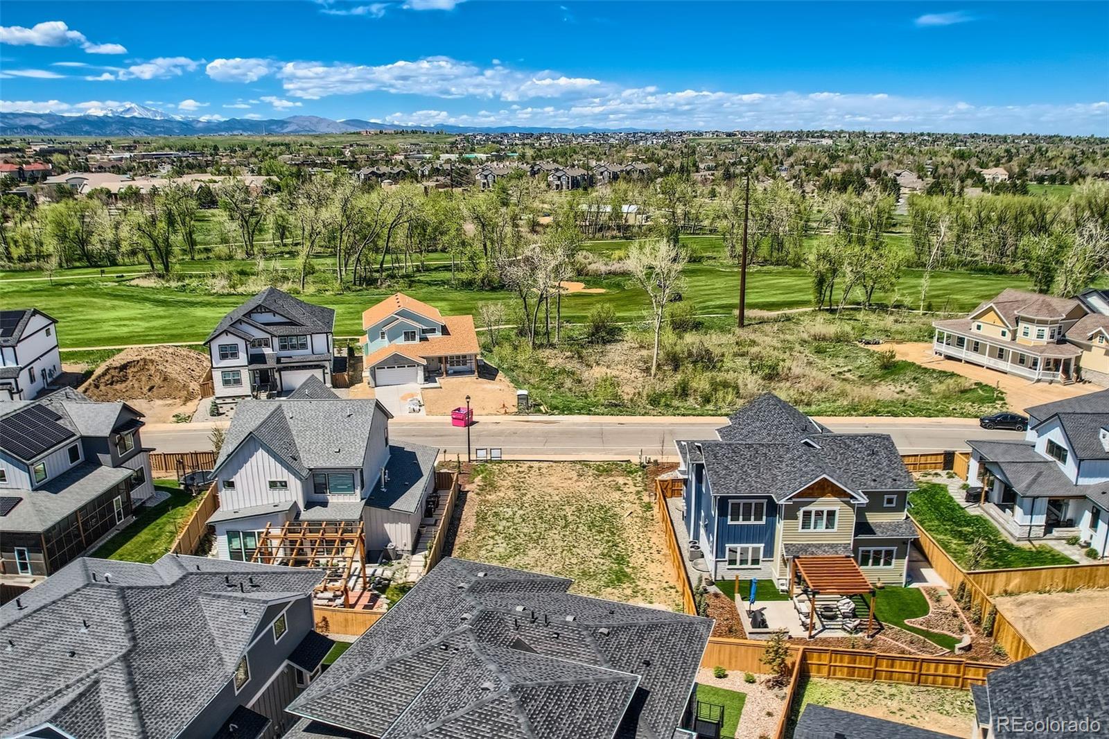 1002 Turnberry Circle Louisville, CO 80027 - Photo 3 of 16 an aerial view of residential houses with outdoor space and ocean view