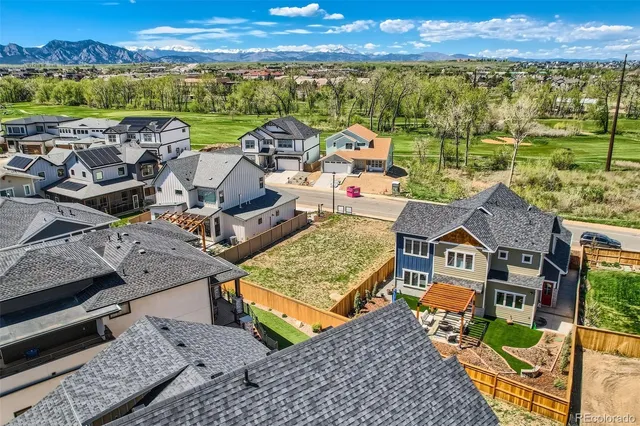 an aerial view of a house with a ocean view