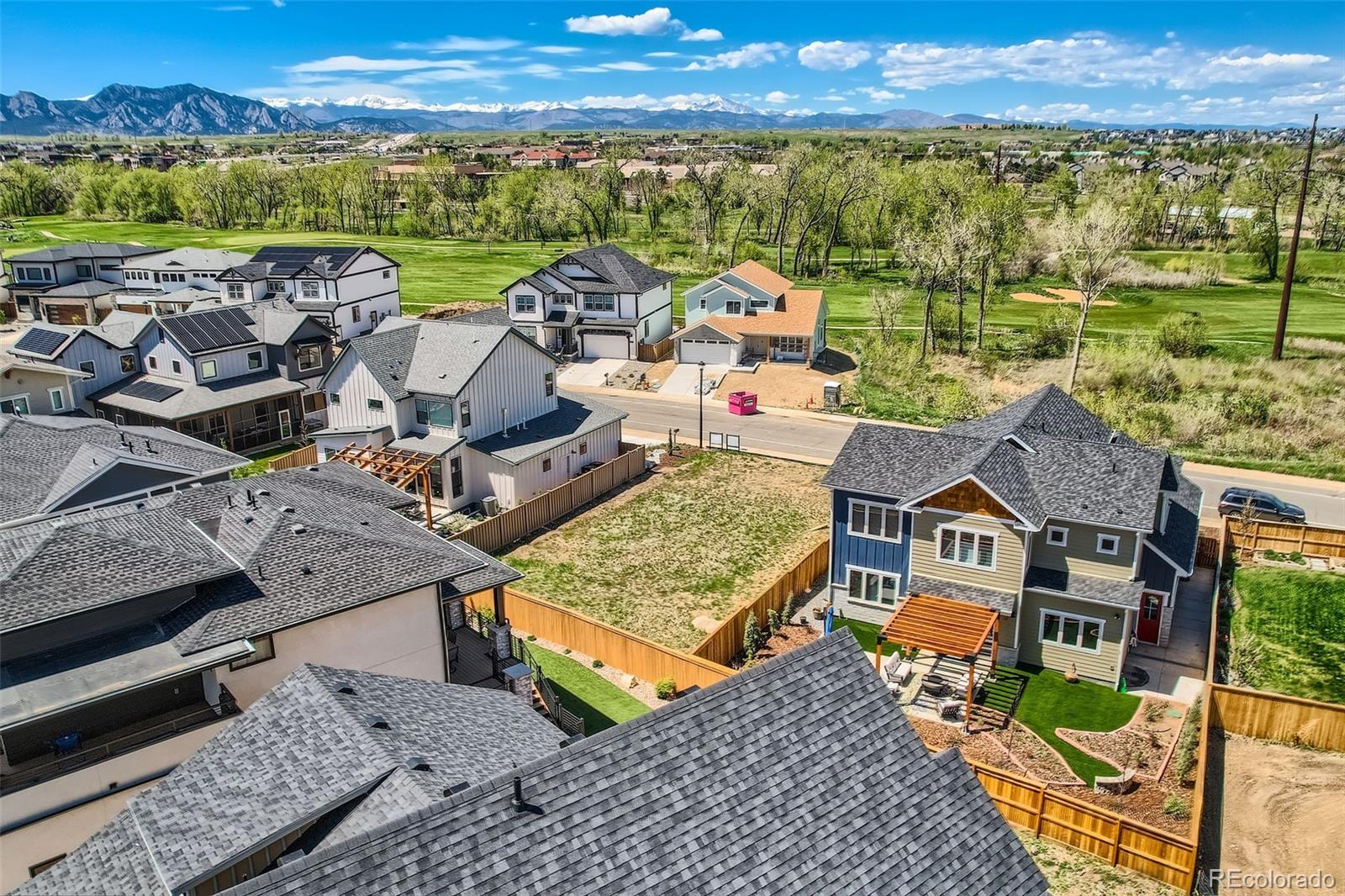 1002 Turnberry Circle Louisville, CO 80027 - Photo 4 of 16 an aerial view of a house with a ocean view