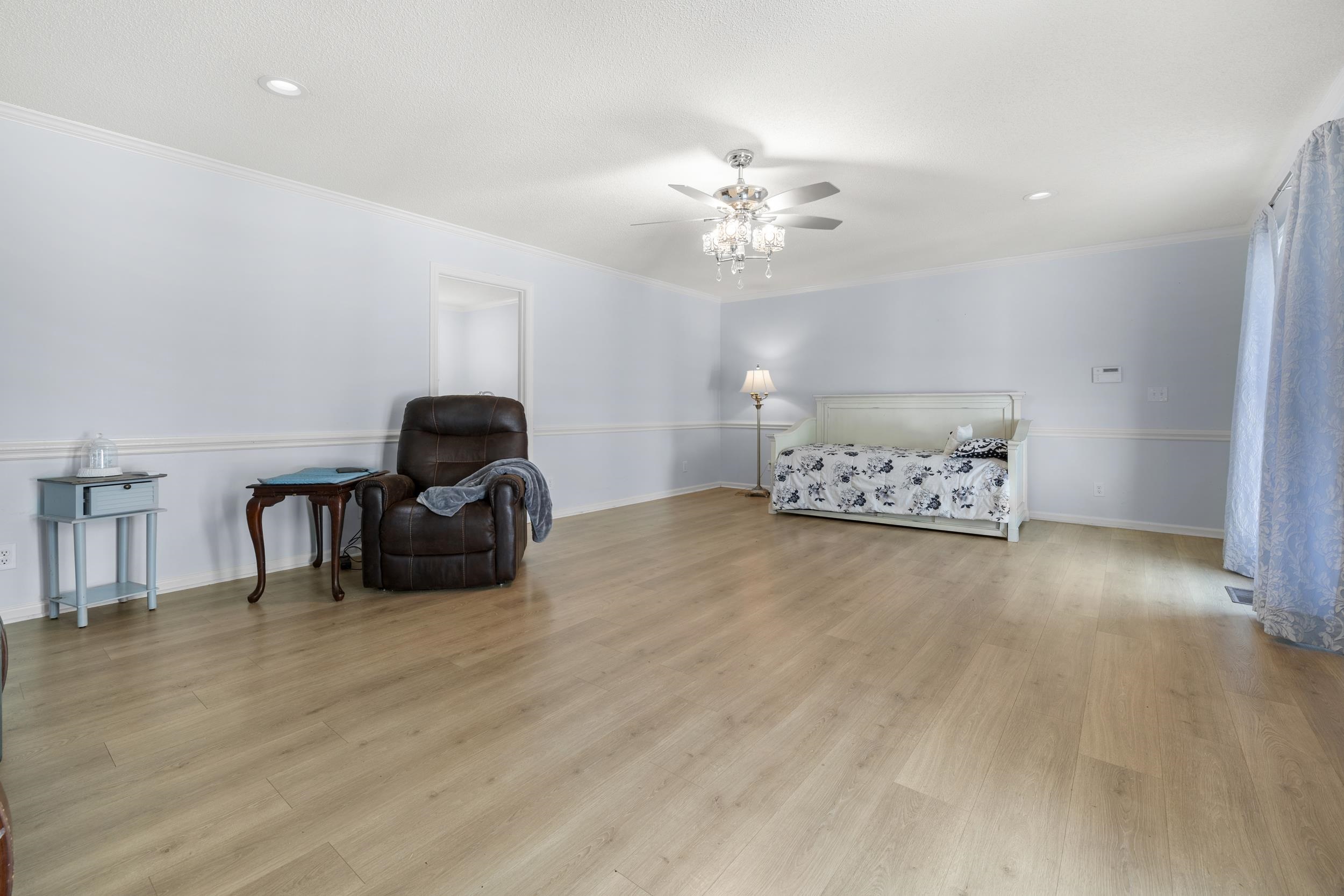 460 Woodbridge Road Somerville, TN 38068 - Photo 15 of 40 Bedroom featuring light wood finished floors, a ceiling fan, ornamental molding, and recessed lighting