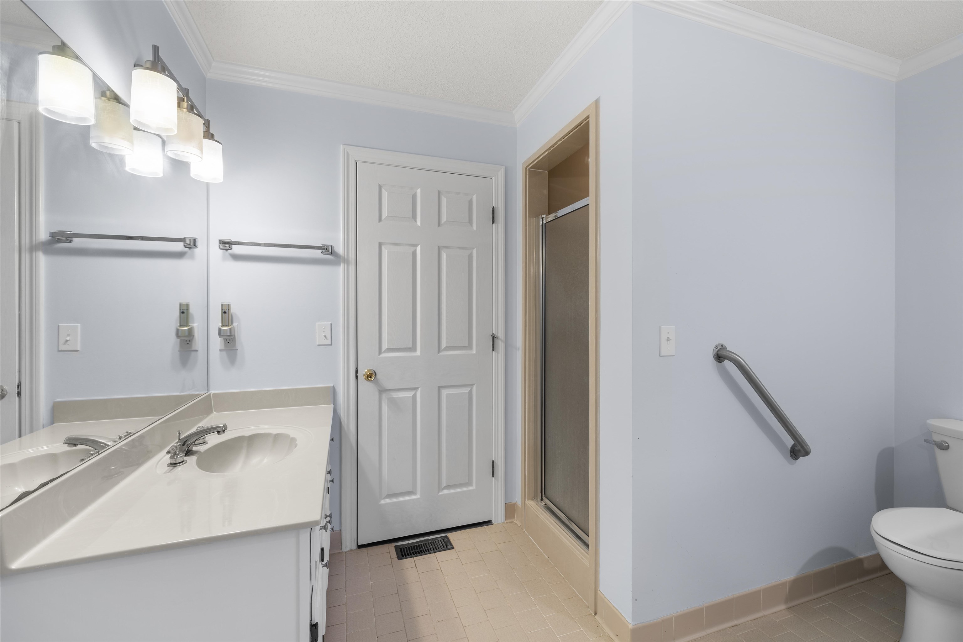 460 Woodbridge Road Somerville, TN 38068 - Photo 17 of 40 Full bathroom featuring vanity, ornamental molding, and a stall shower