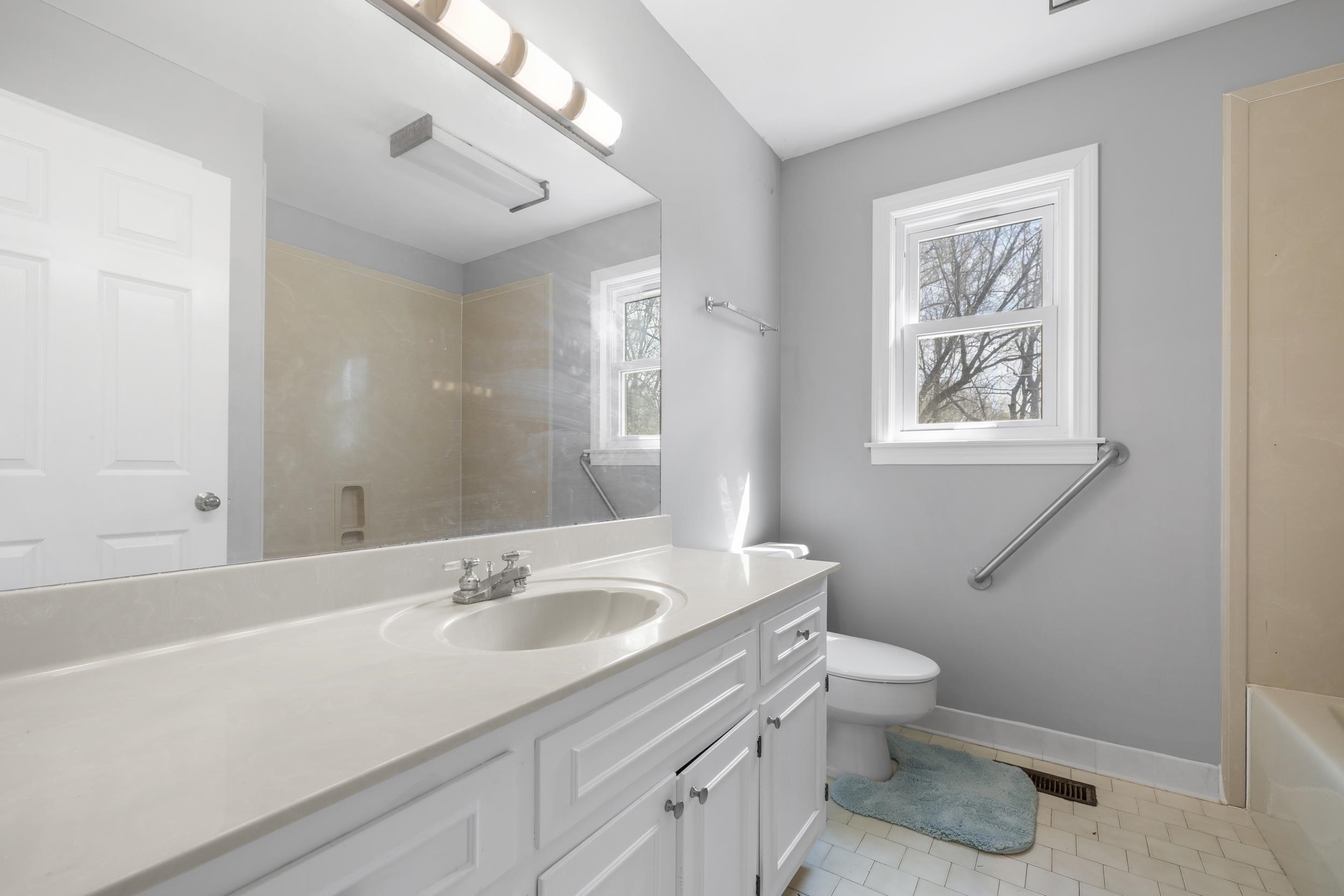 460 Woodbridge Road Somerville, TN 38068 - Photo 19 of 40 Bathroom featuring vanity, a shower, light tile patterned flooring, and a tub to relax in