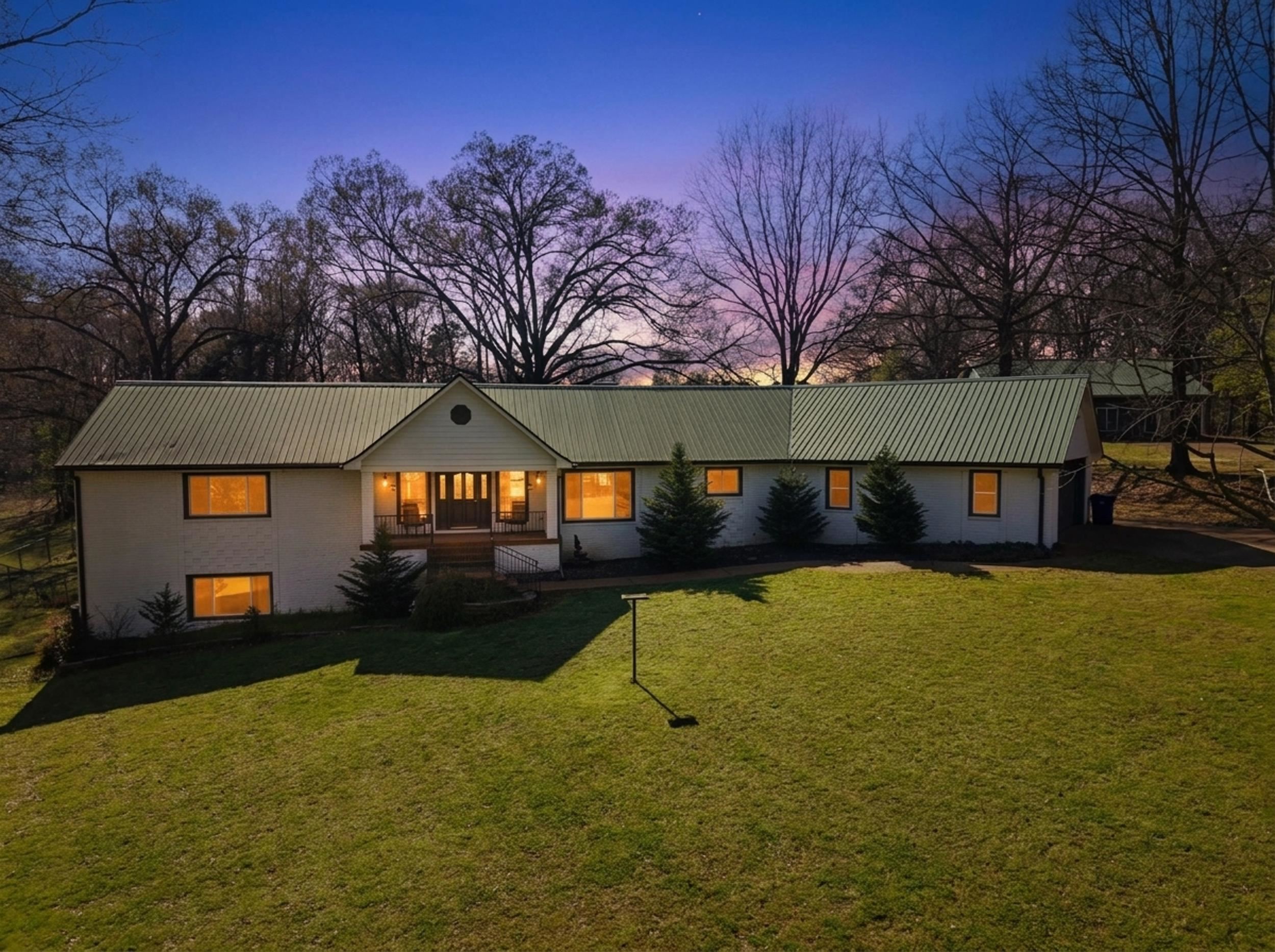460 Woodbridge Road Somerville, TN 38068 - Photo 2 of 40 View of front of house featuring a front yard, a porch, and a metal roof