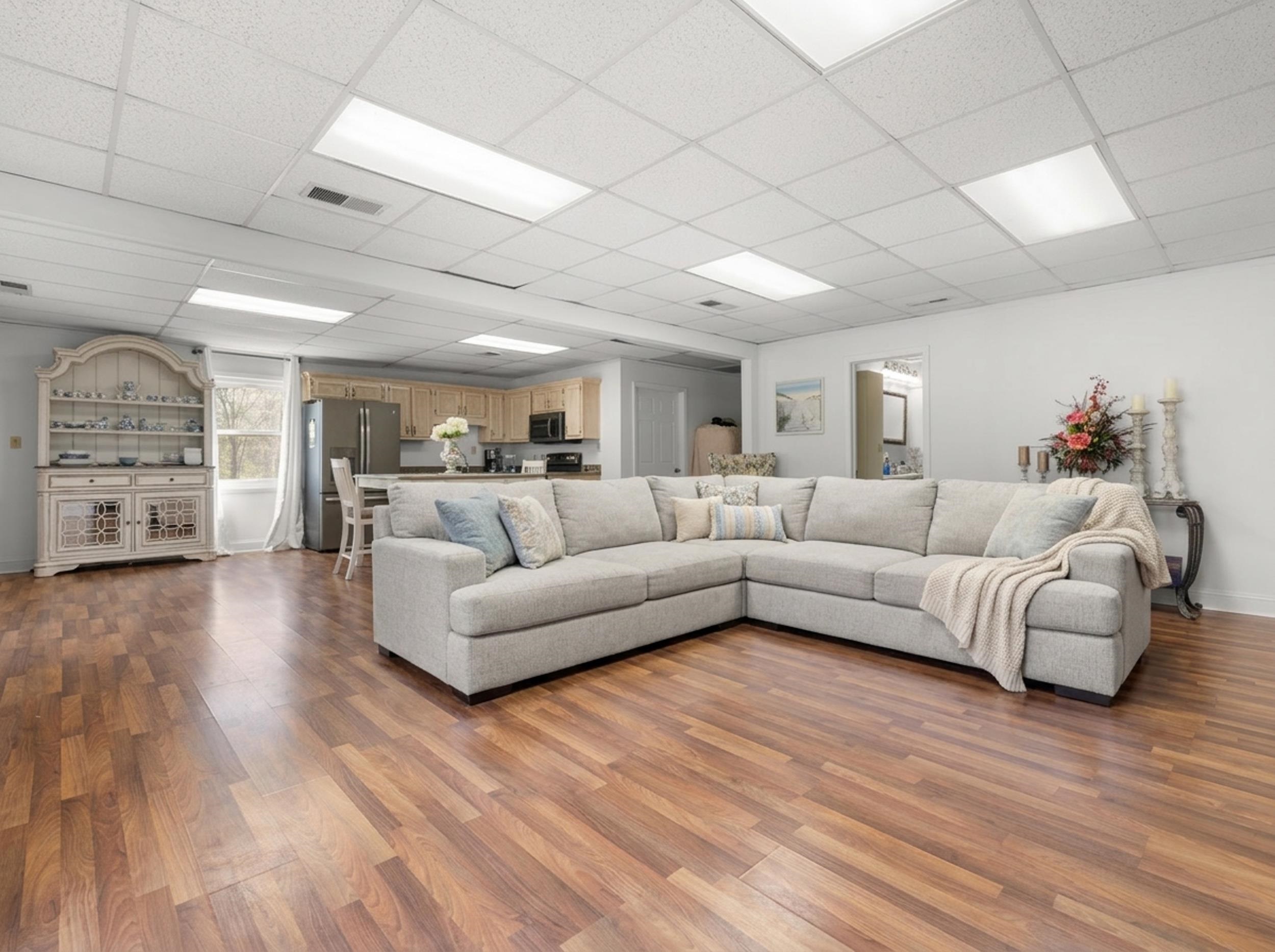 460 Woodbridge Road Somerville, TN 38068 - Photo 34 of 40 Living room featuring a paneled ceiling and light wood-style floors