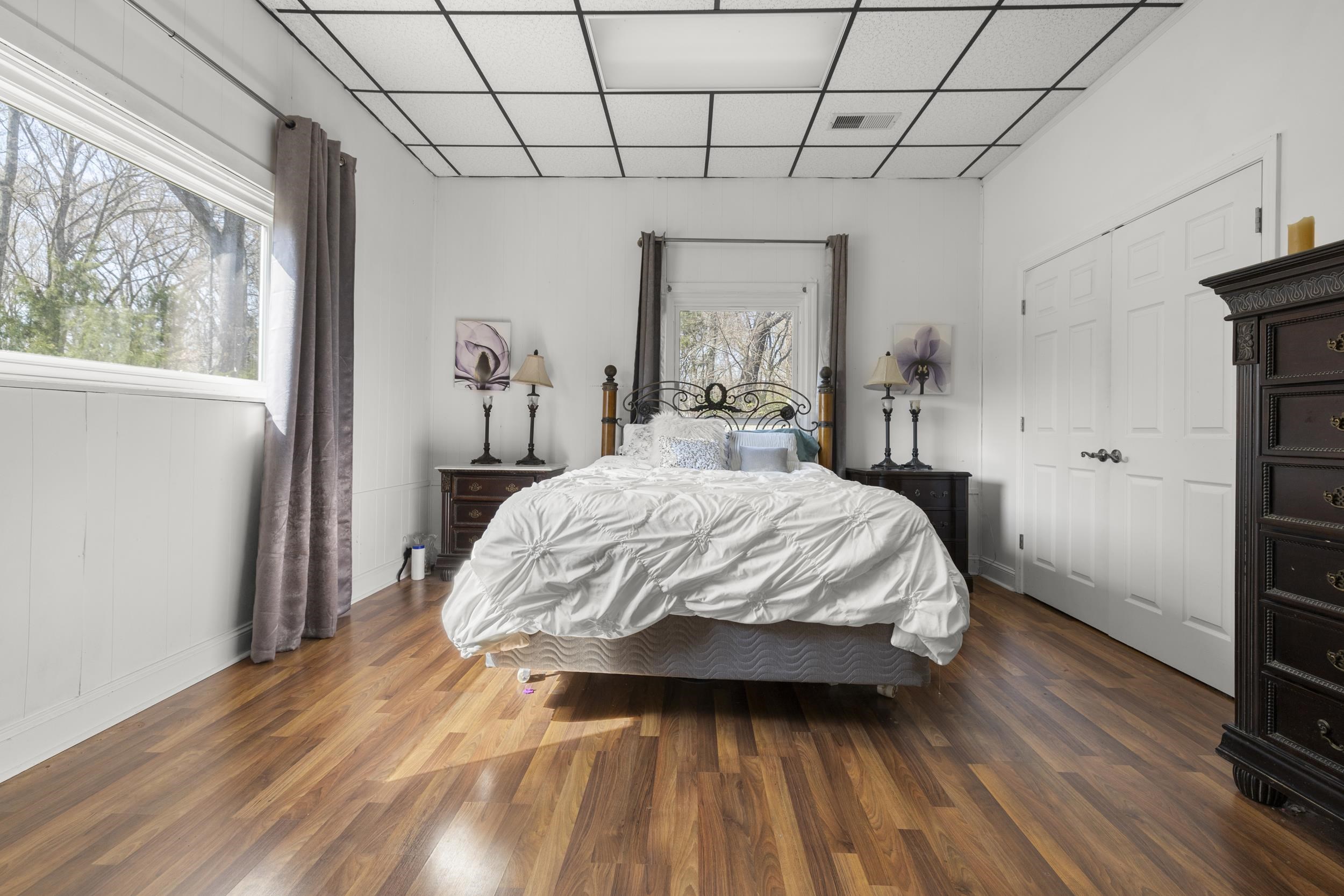 460 Woodbridge Road Somerville, TN 38068 - Photo 36 of 40 Bedroom with a drop ceiling, dark wood-style floors, and a closet