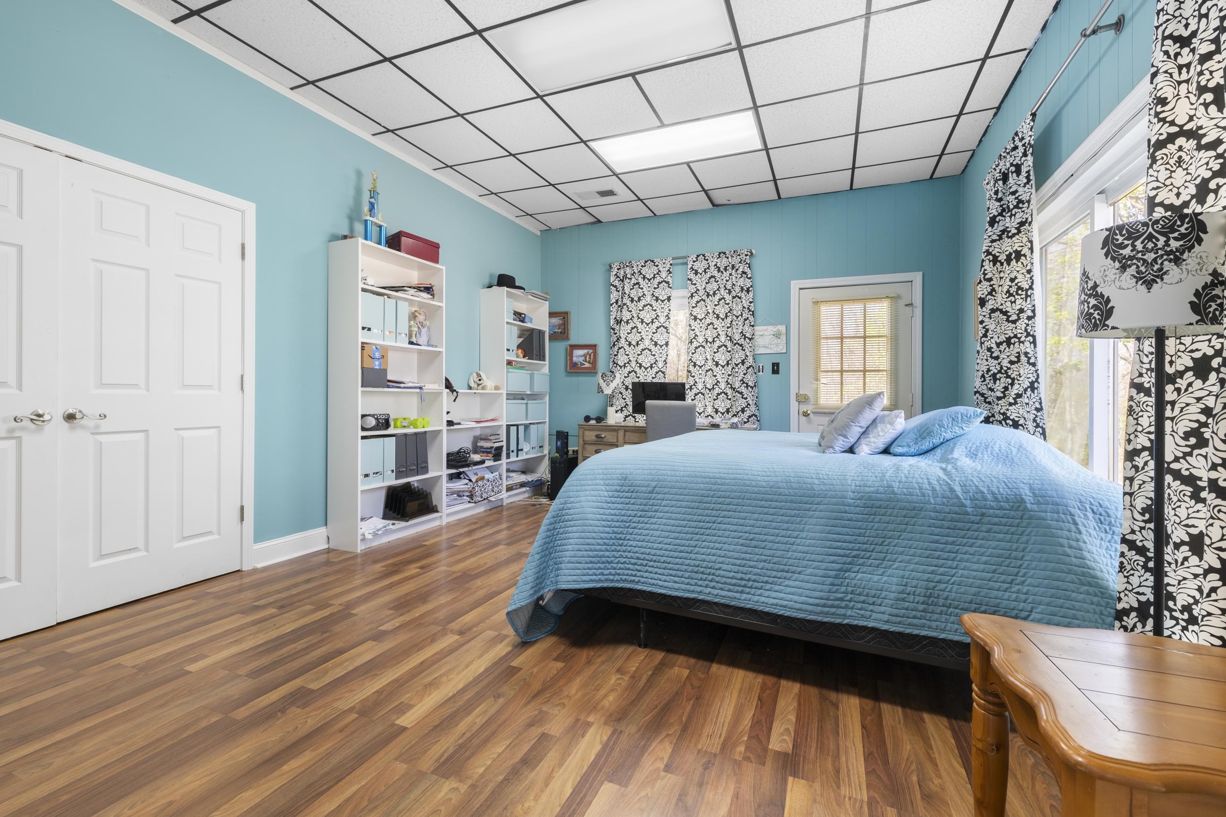 460 Woodbridge Road Somerville, TN 38068 - Photo 37 of 40 Bedroom featuring a drop ceiling and dark wood-style floors